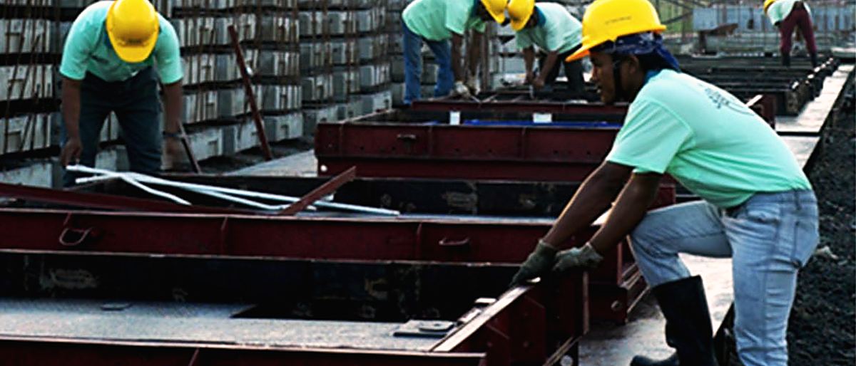Site crew preparing steel reinforcement and formwork on a civil works project